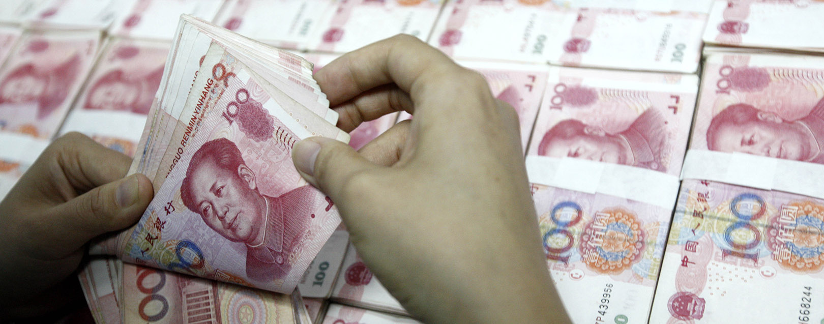 Yuan falls to new 5.5 year low as PBOC stays aside